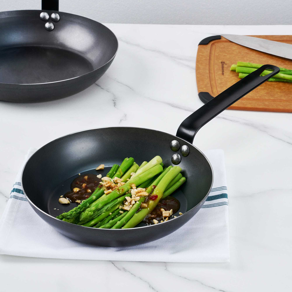 Met Lux 1 Black Carbon Steel 9 1/2" Pre-Seasoned Fry Pan and 1 Black Silicone Pan Handle Sleeve