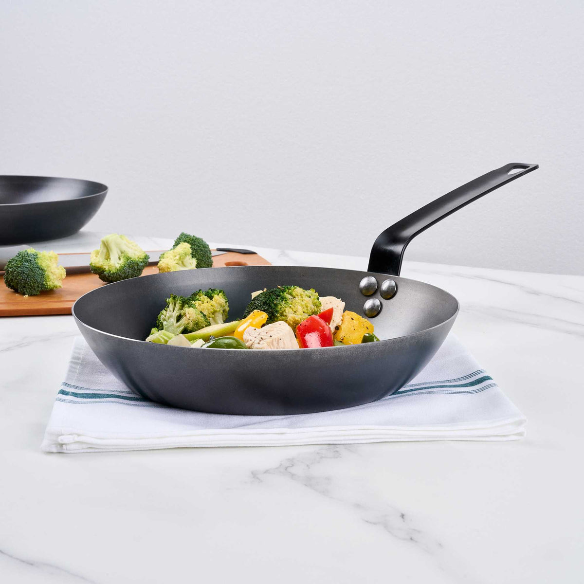 Met Lux 1 Black Carbon Steel 10" Pre-Seasoned Fry Pan and 1 Black Silicone Pan Handle Sleeve