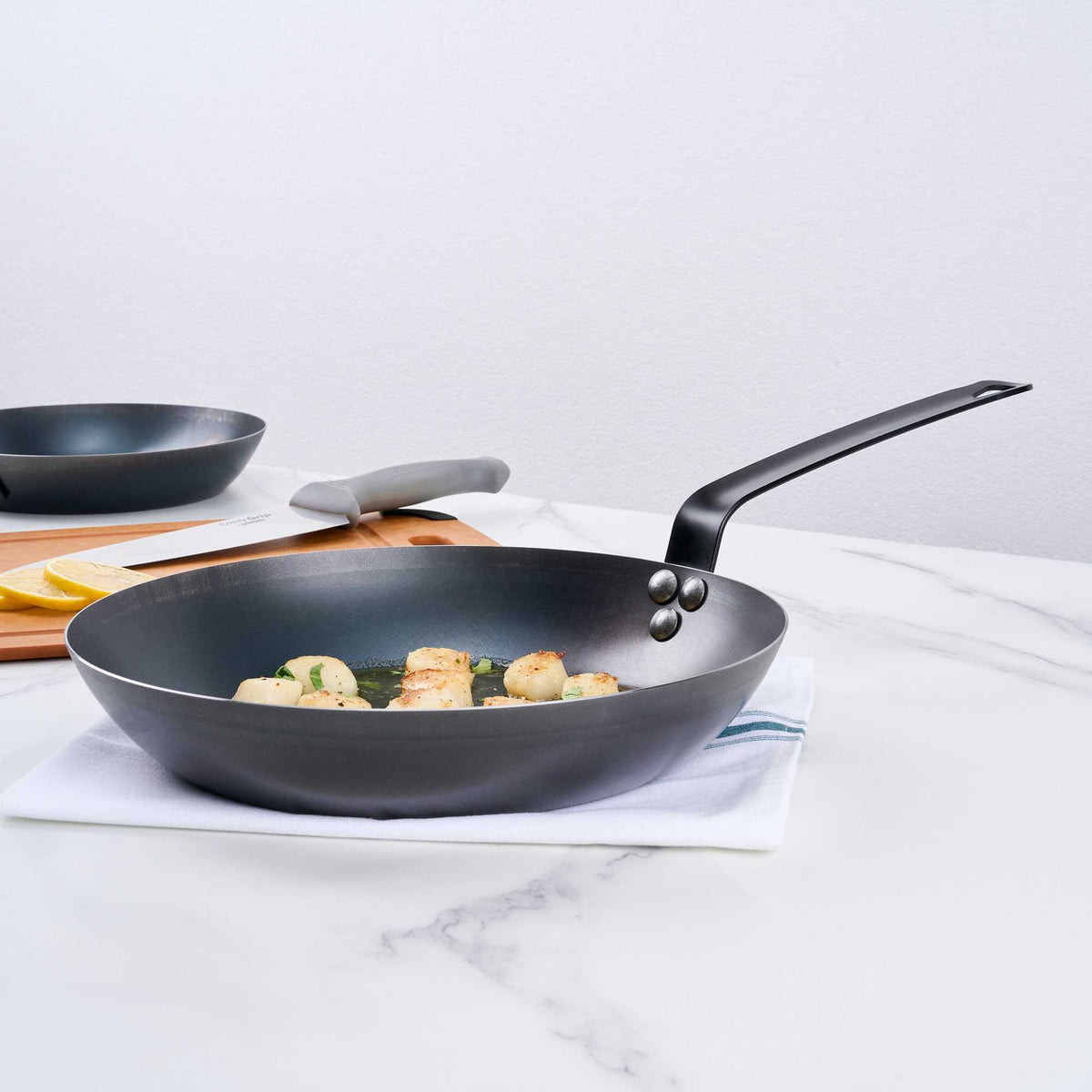 Met Lux 1 Black Carbon Steel 11" Pre-Seasoned Fry Pan and 1 Black Silicone Pan Handle Sleeve