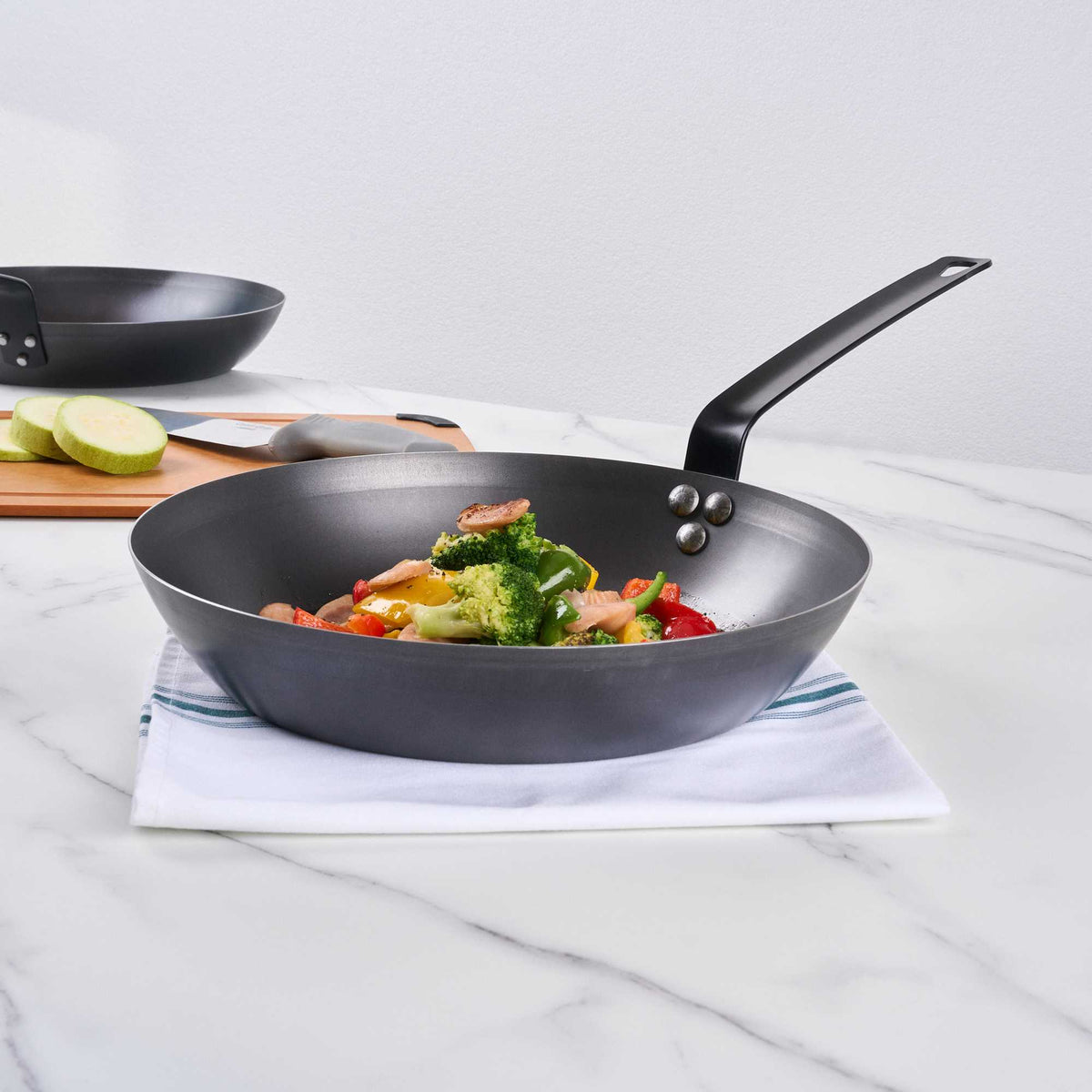 Met Lux 1 Black Carbon Steel 12" Pre-Seasoned Fry Pan and 1 Black Silicone Pan Handle Sleeve