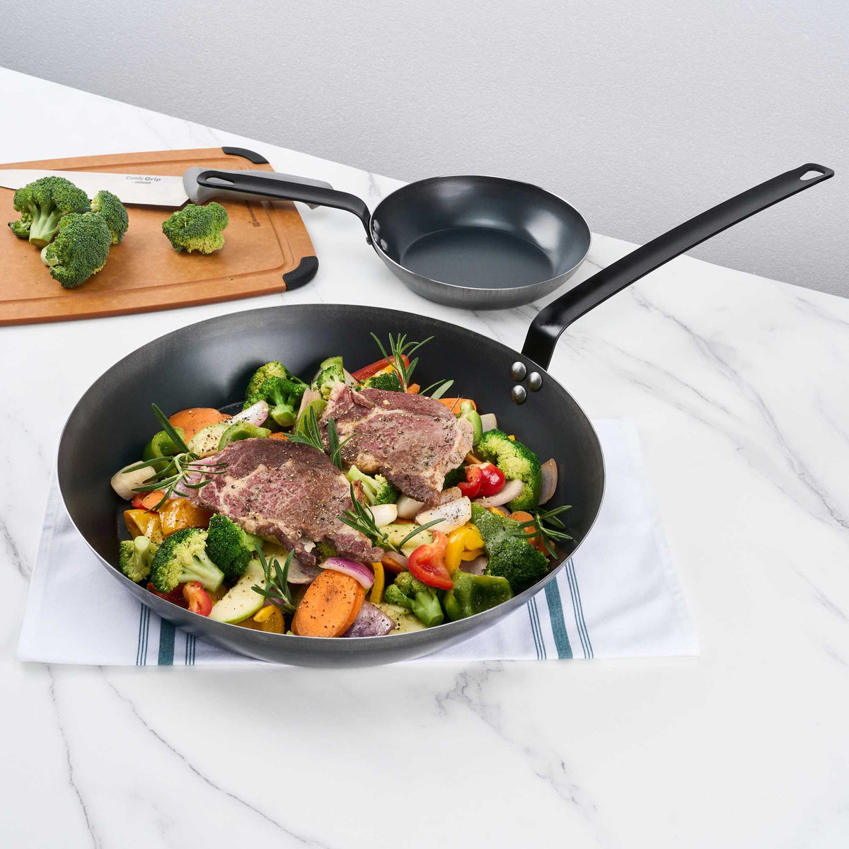 Met Lux 1 Black Carbon Steel 16" Pre-Seasoned Fry Pan and 1 Black Silicone Pan Handle Sleeve