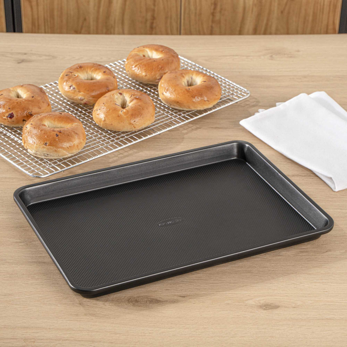 Pastry Tek Black Carbon Steel Jelly Roll Sheet Pan - Non-Stick, Tapered Edge - 15 1/4" x 10 3/4" x 1 1/4" - 1 count box