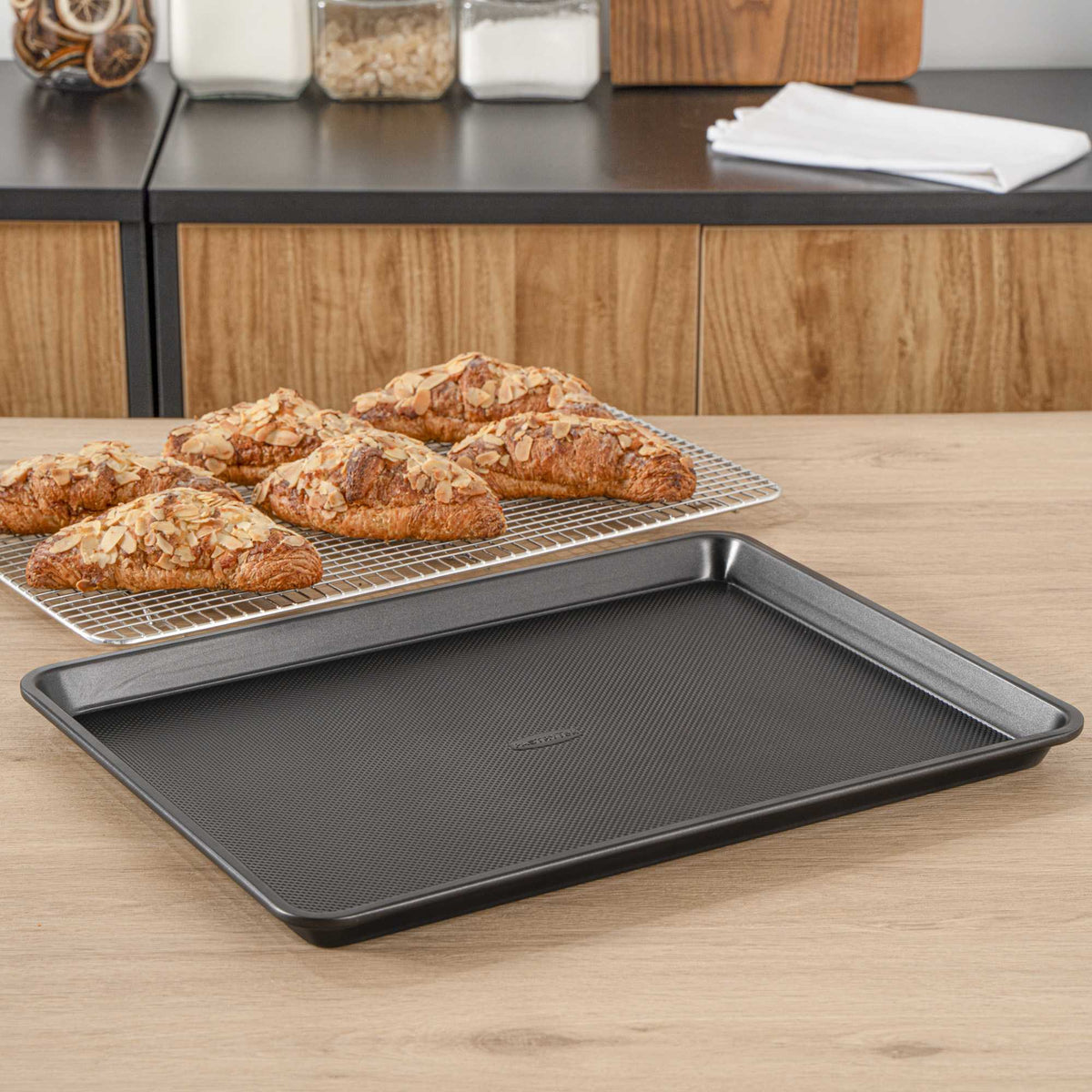 Pastry Tek Black Carbon Steel Half Size Sheet Pan - Non-Stick, Tapered Edge - 17 1/4" x 13" x 1 1/4" - 1 count box